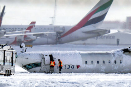 day-in-photos:-plane-crash-in-canada,-us-russia-negotiations,-and-snow-maze-in-poland