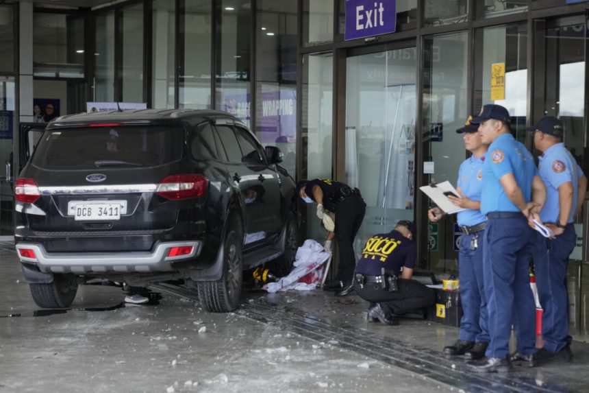vehicle-crashes-into-entrance-at-manila-airport,-killing-2-people-including-young-girl