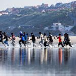 day-in-photos:-migrants-crossing-english-channel,-forest-fires-in-turkey,-and-largest-flower-bloomed