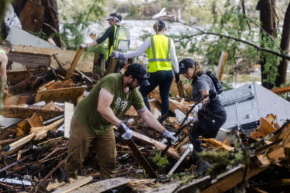 day-in-photos:-catastrophic-flooding-in-texas,-wildfire-in-france,-and-elephant-orphanage