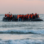 day-in-photos:-migrants-in-the-english-channel,-beautiful-sailboats,-and-a-baby-pygmy-hippo