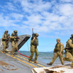 day-in-photos:-amphibious-landing-rehearsal,-grand-canyon-fire,-end-of-san-fermin