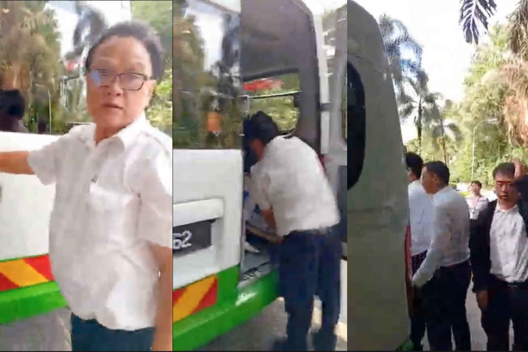 individuals-claiming-to-be-chinese-police-steal-from-falun-gong-booth-in-malaysia,-video-shows