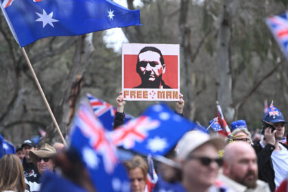 man-arrested-over-‘offensive’-placard-at-immigration-rally