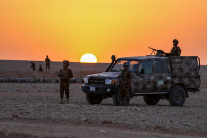 day-in-photos:-iraqi-army-patrols-border,-france-returns-skulls-to-madagascar,-and-giant-landfill-in-indonesia