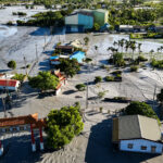 day-in-photos:-barrier-lake-burst-in-taiwan,-protests-in-madagascar,-and-thousands-of-wading-birds