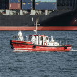 day-in-photos:-cruise-ship-crew-members-evacuated,-transport-strike,-and-battle-reenactment
