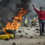day-in-photos:-kenya-fuel-price-protests,-openai-wins-lawsuit,-and-sandy-fire-evacuation
