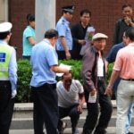 china-cuts-300,000-enforcement-officers-amid-complaints-of-abuse,-mounting-fiscal-stress