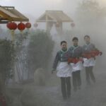 chinas-farm-getaways-close-by-the-tens-of-thousands-as-economy-slows